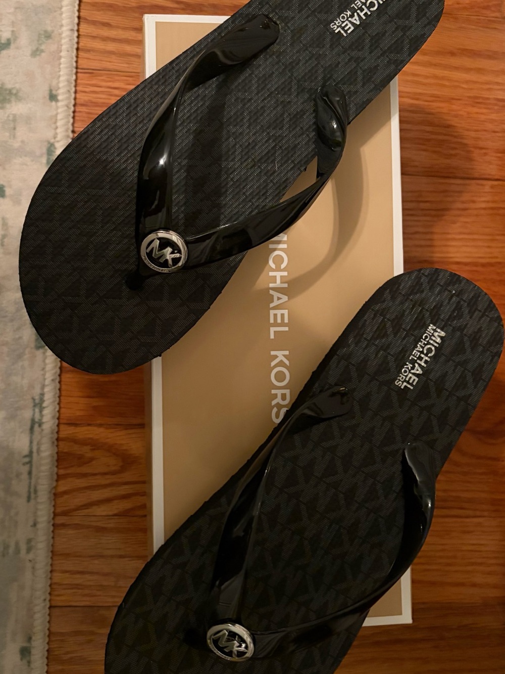 Michael Kors Black Logo Flip Flops with Silver MK Medallion